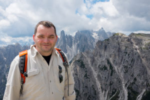 Daniel Apai at the Dolomites mountain range, that preserves a thick layer of Triassic coral reefs.